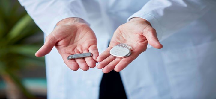 Doctor Holding Interstim Neurostimulators